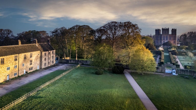 An aerial view of the holiday cottages 6 High Hazels and 4 Stable Yard, and Hardwick Hall, which is a short walk away, Derbyshire